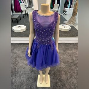 size 14. purple color. 2 piece. tulle bottom skirt. high neck top
